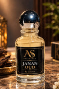 Janan Oud perfume bottle by AS Fragrance on marble with oud chips and candles
