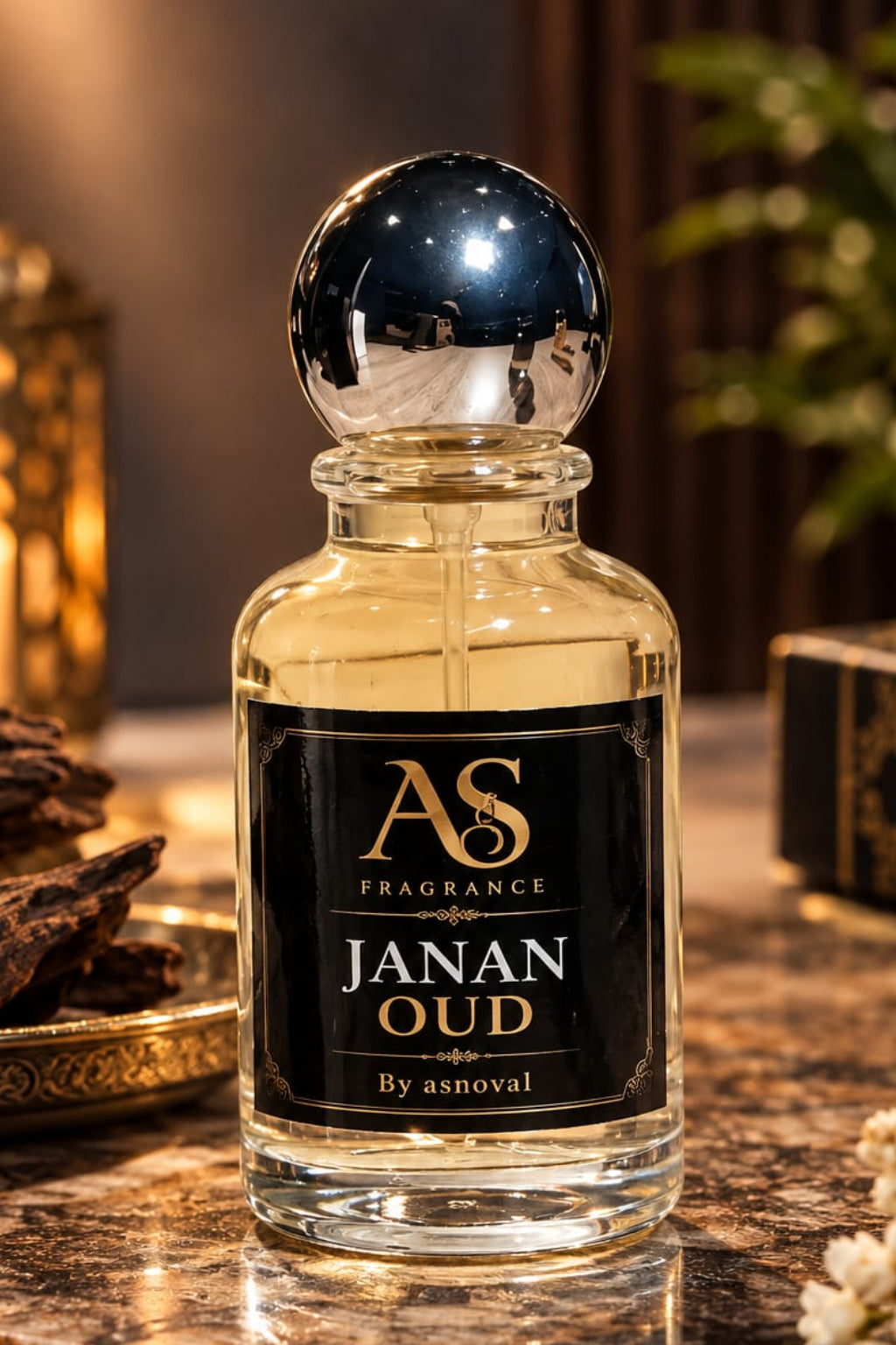 Janan Oud perfume bottle by AS Fragrance on marble with oud chips and candles
